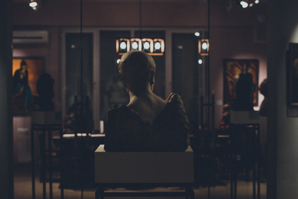 woman in black long sleeve shirt sitting on chair