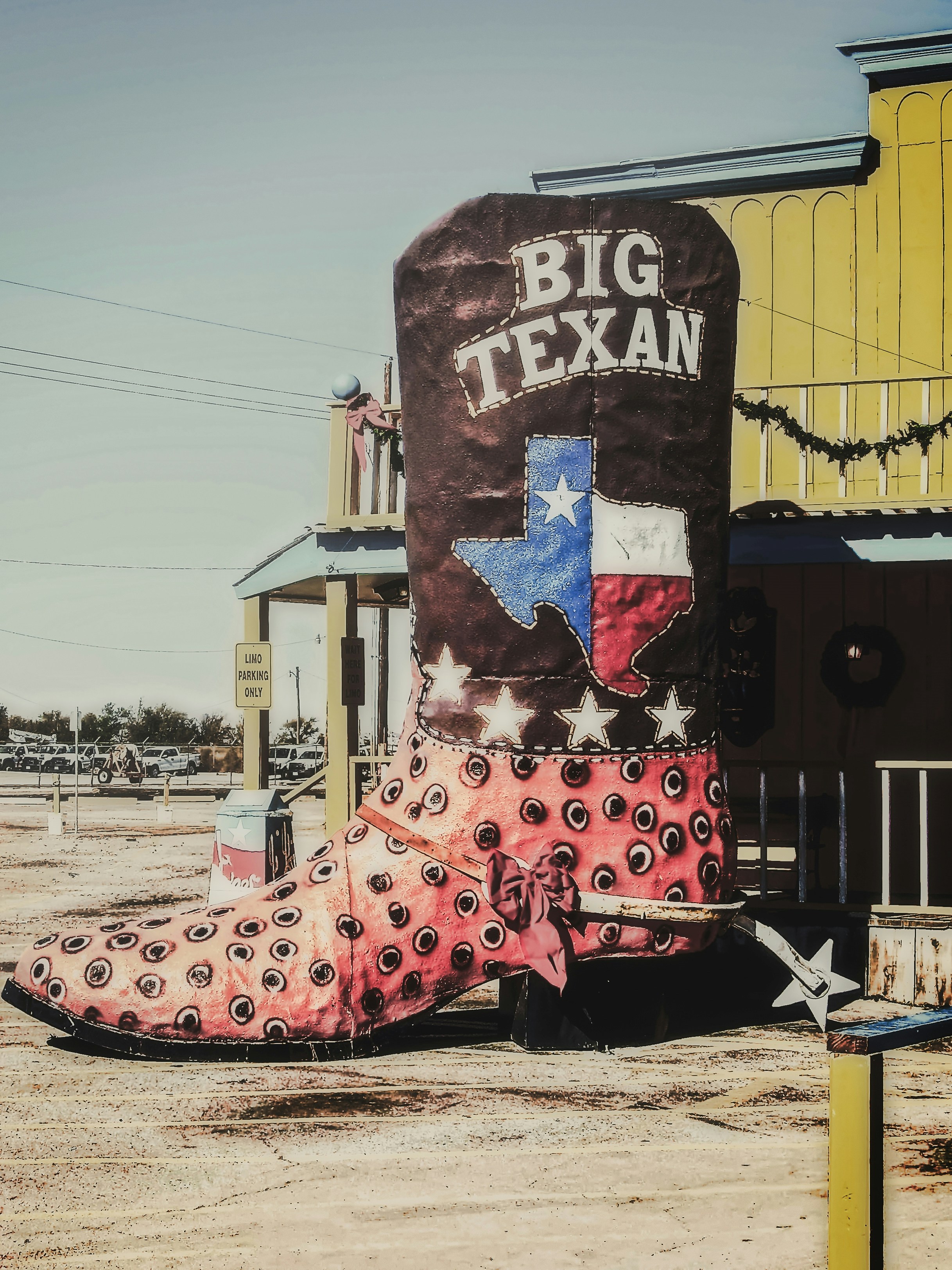 A giant ostrich book with spurs outside The Big Texan Steak House in Amarillo, Texas, USA on a very hot and sunny November afternoon (2008).