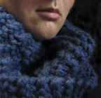 A cozy wool scarf wrapped around a person’s neck on a chilly day.