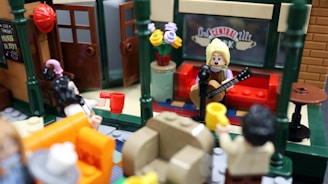A playful Lego stop motion moment capturing a humorous interaction between two Lego characters in a miniature café.