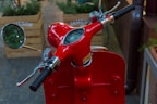 Close-up of a brown leather handlebar grip on a modern electric scooter