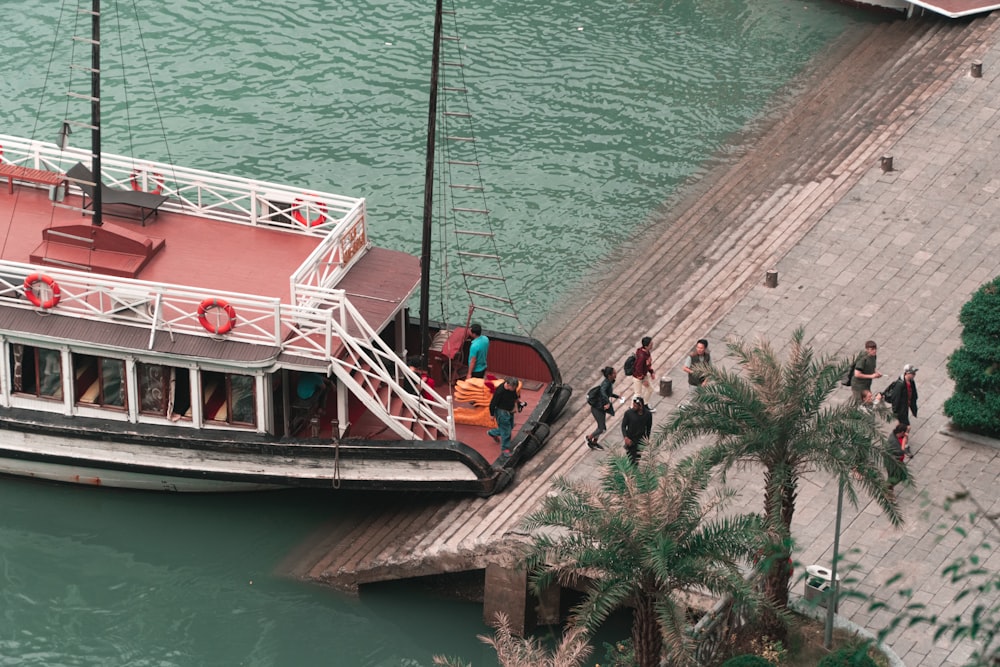 people on boat on water during daytime