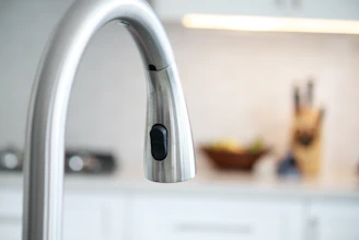 stainless steel faucet in tilt shift lens