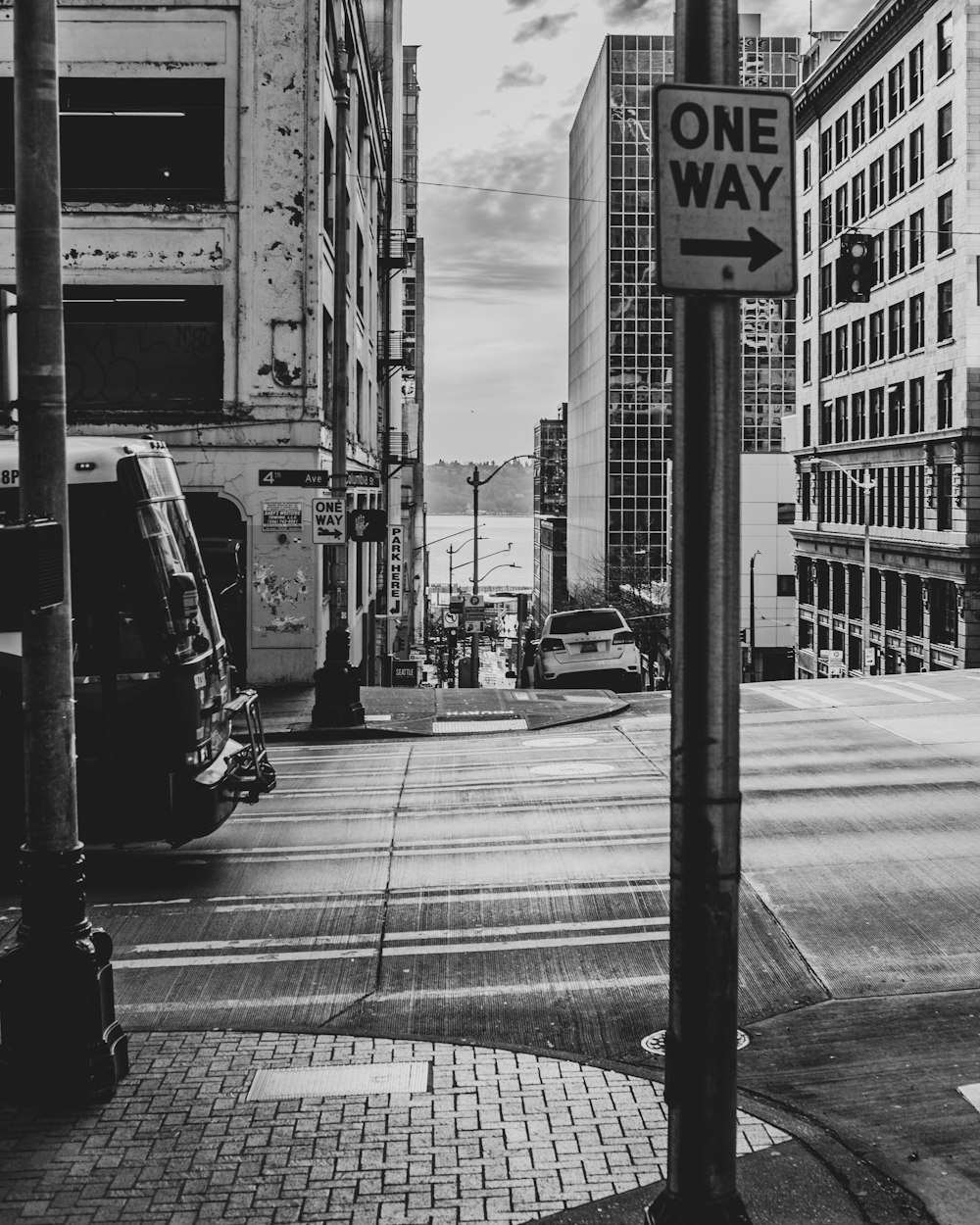 grayscale photo of cars on road