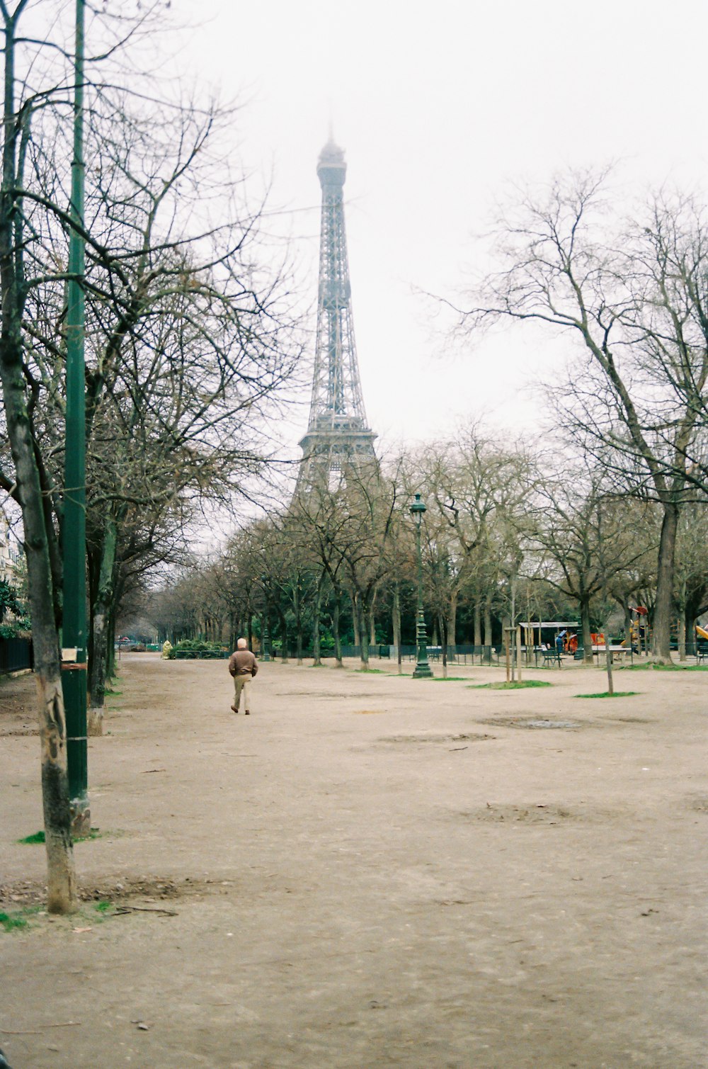 people walking on park near eiffel tower during daytime