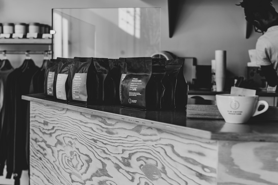 black and gray backpack on white wooden table