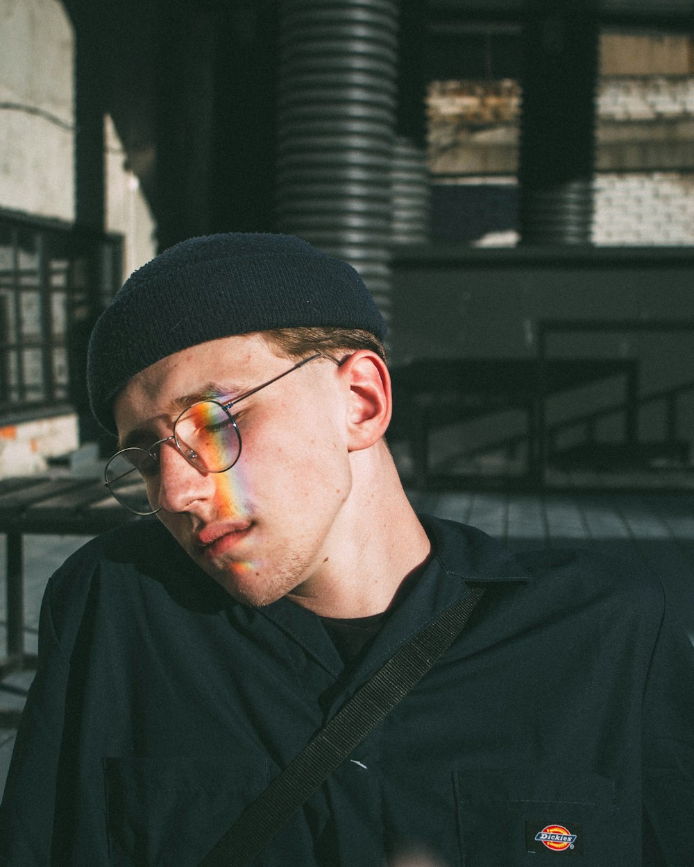 man in black knit cap and black framed eyeglasses