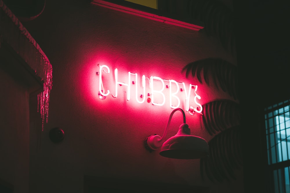 red and white love neon light signage