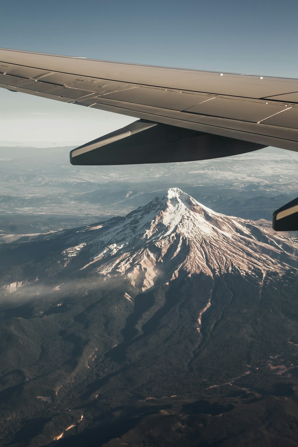 white and black mountain under white clouds during daytime