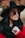 woman in black sun hat and red shirt wearing aviator sunglasses