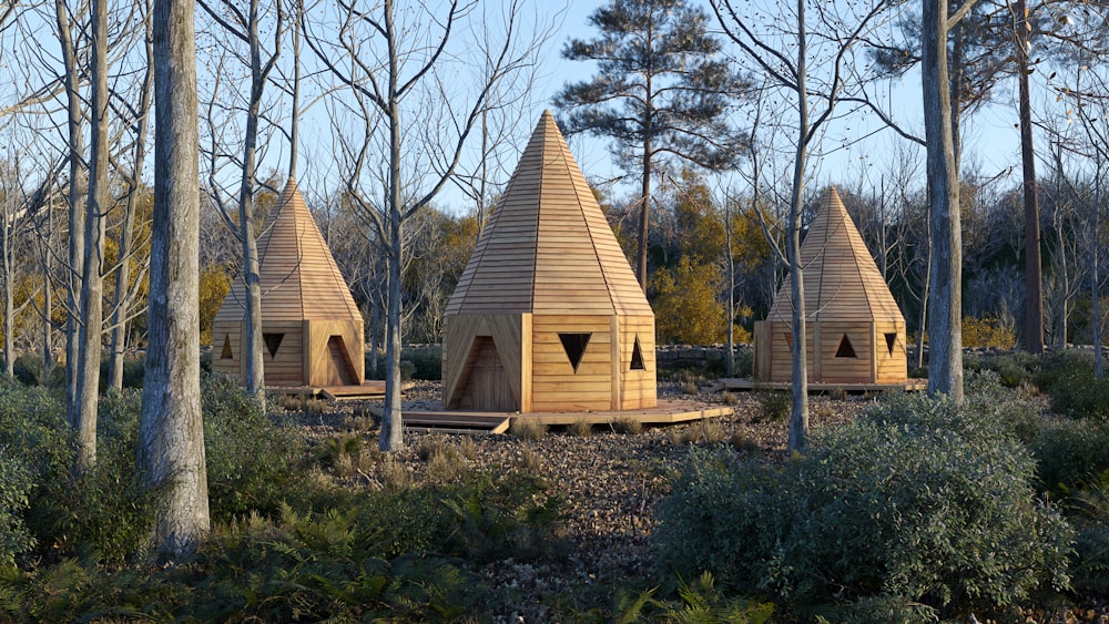 brown wooden house near bare trees during daytime