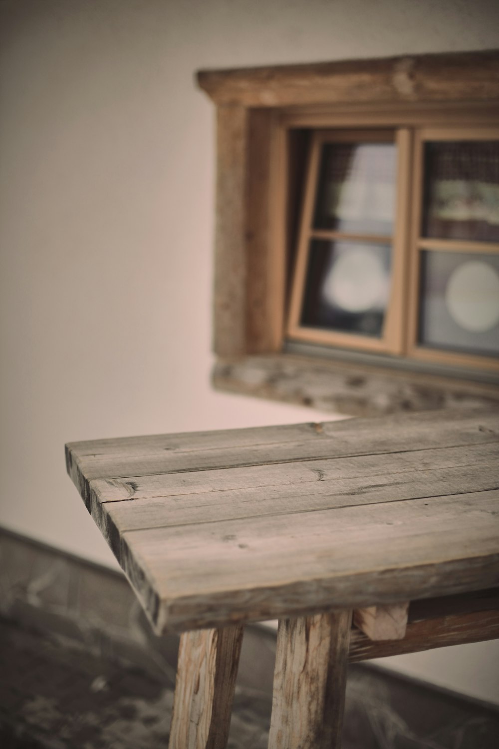 brown wooden window frame with white wall