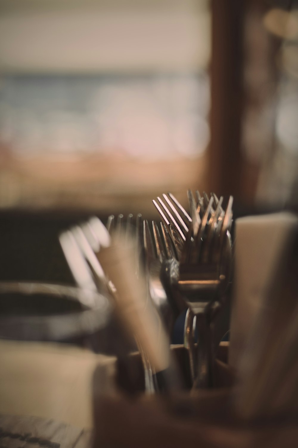 silver fork and knife on brown wooden table