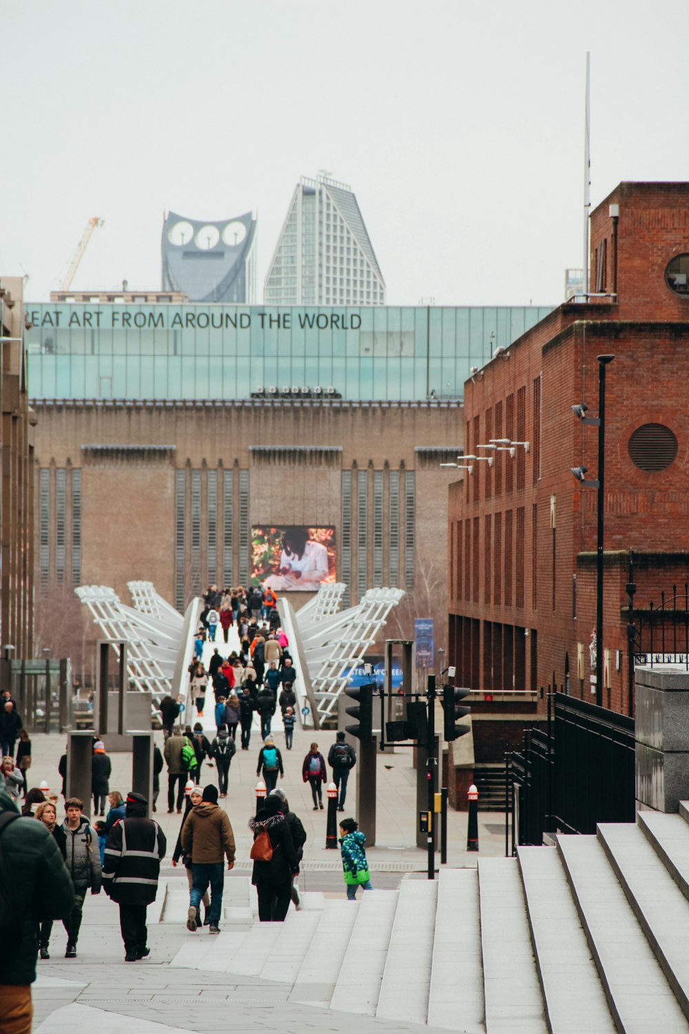 people walking on street near brown building during daytime