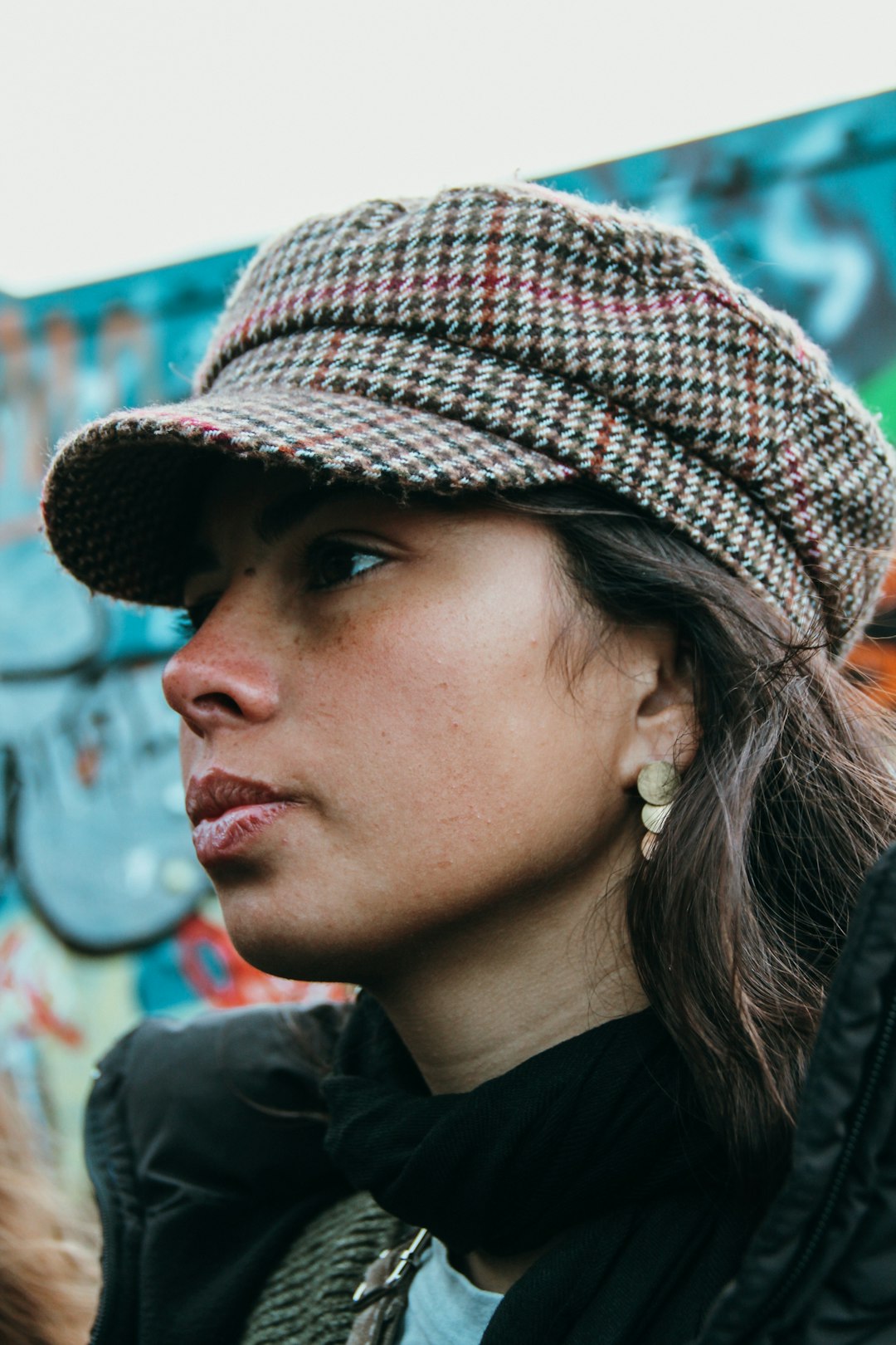 woman in black and red knit cap