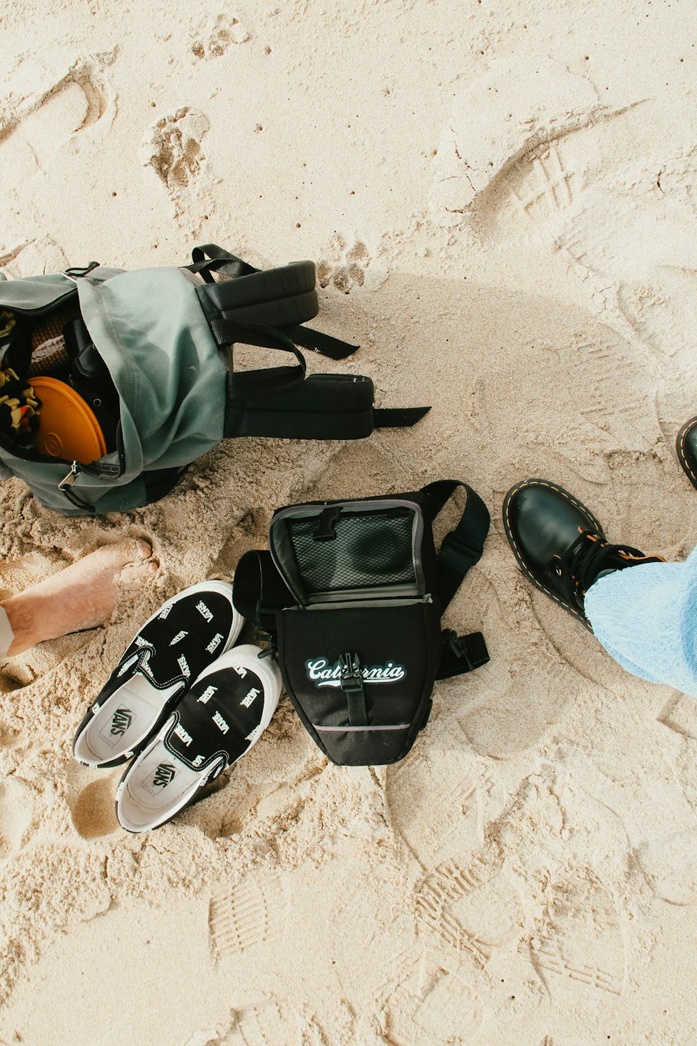 black and white nike backpack on white sand