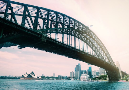 gray metal bridge over body of water during daytime in Sydney Harbour Bridge Australia