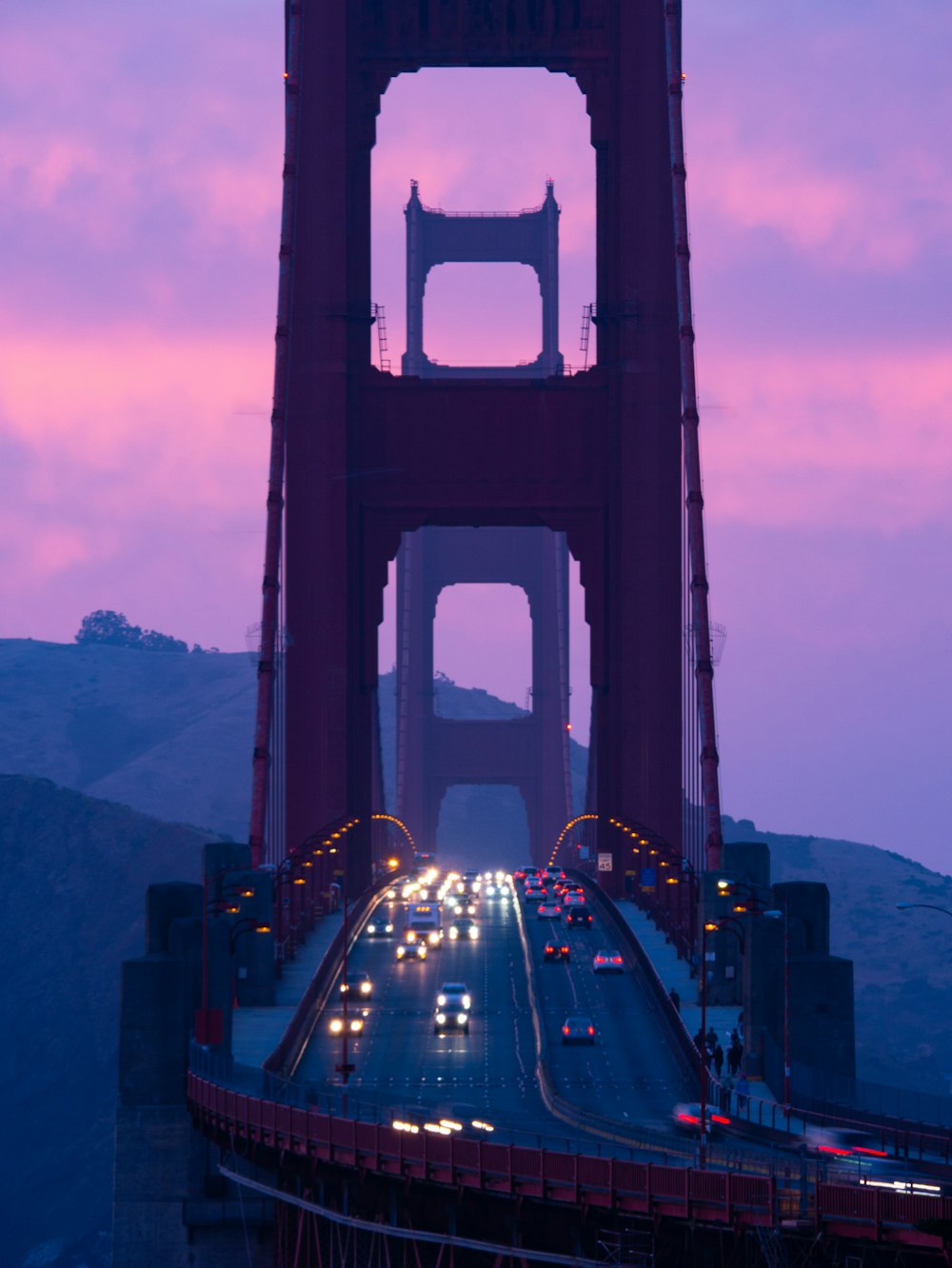 cars on bridge during night time