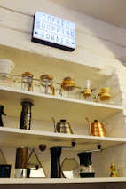 A cozy corner of the online store showing various coffee bags and brewing tools.