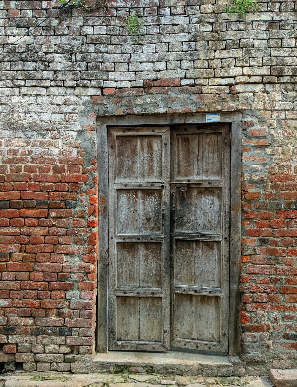 brown wooden window on brown brick wall