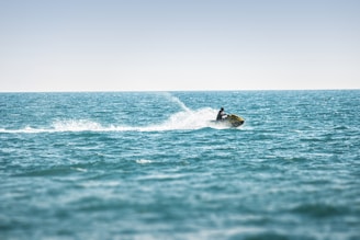 man surfing on sea waves during daytime
