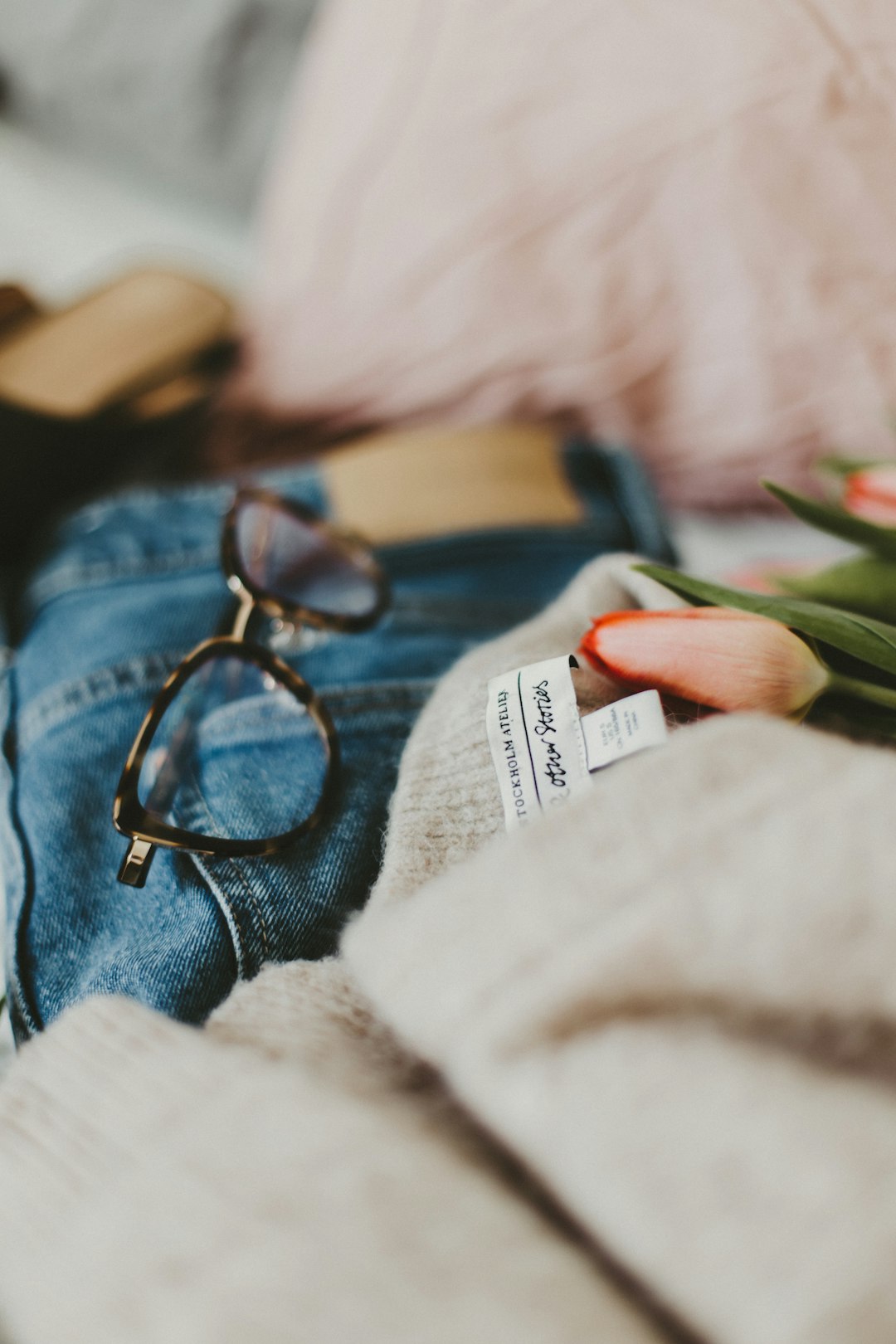 black framed eyeglasses on blue denim textile