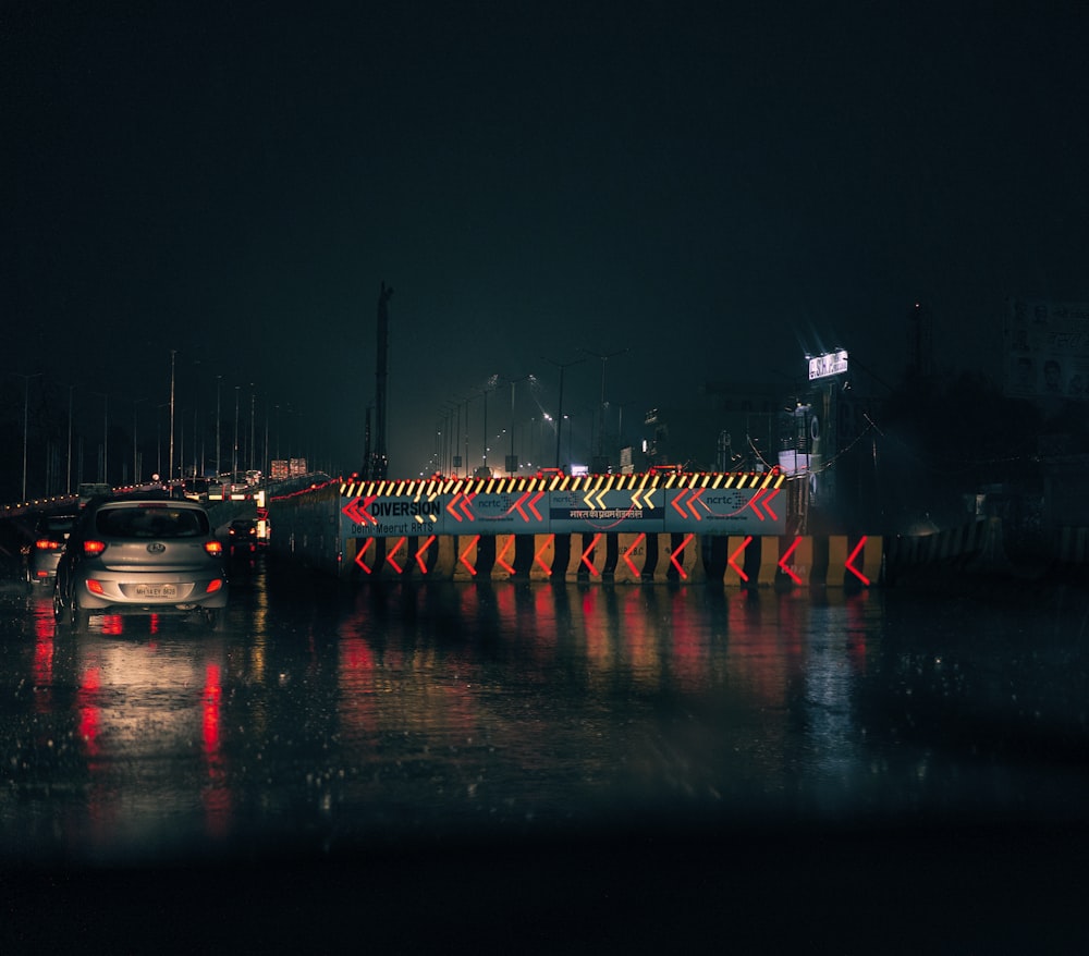 white and black boat on water during night time