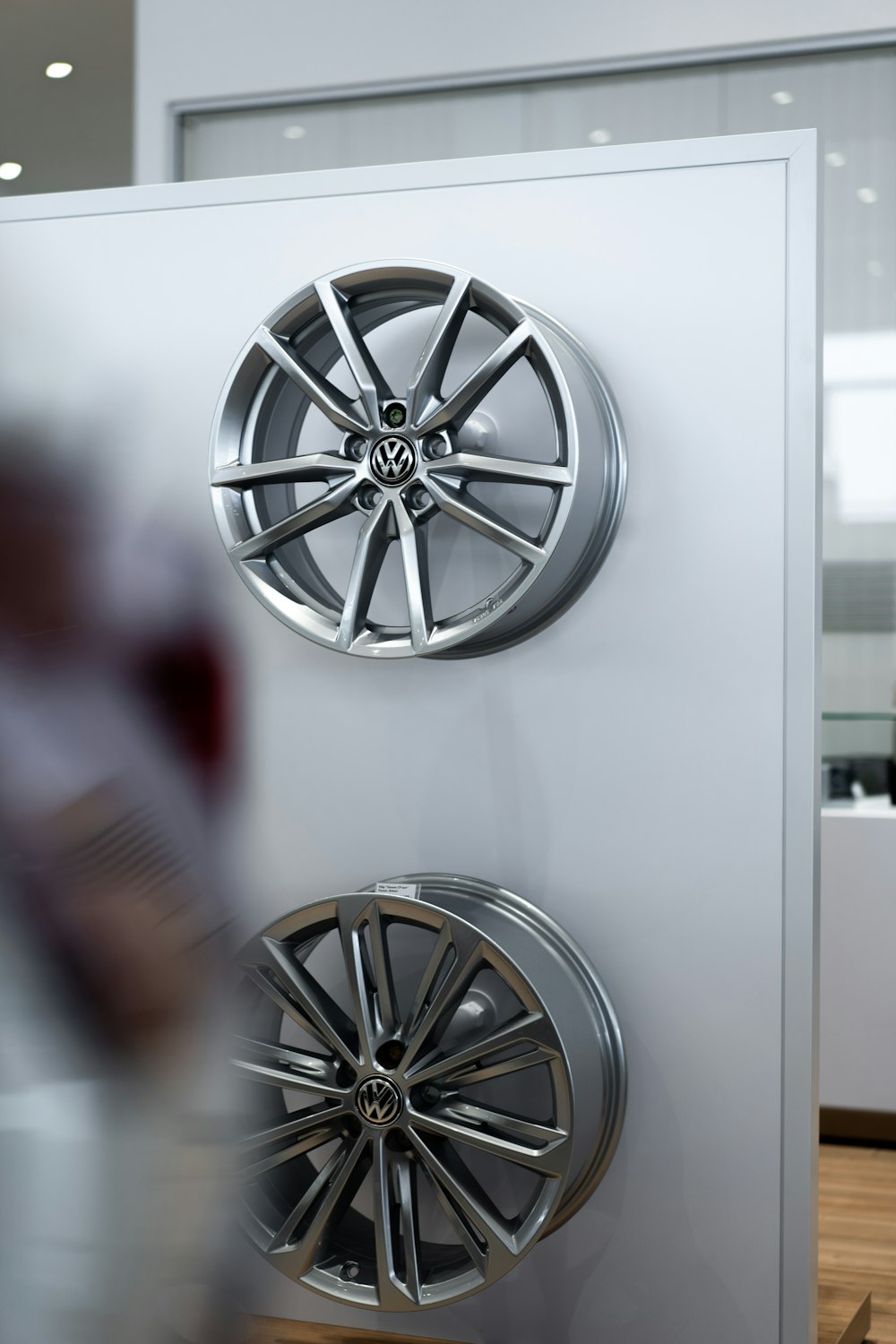 silver mercedes benz wheel on white table