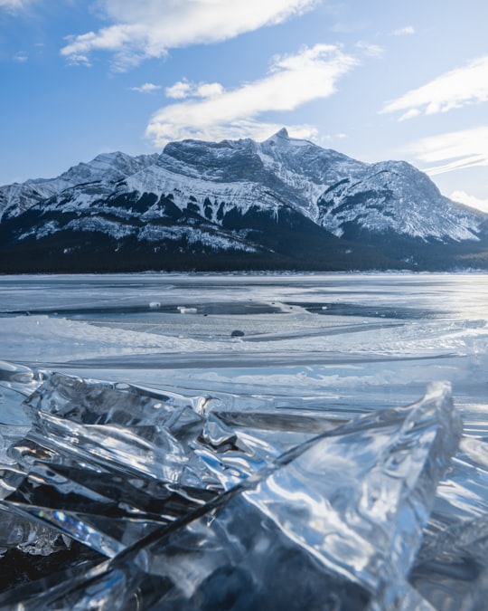 snow covered mountain during daytime in Abraham Lake Canada