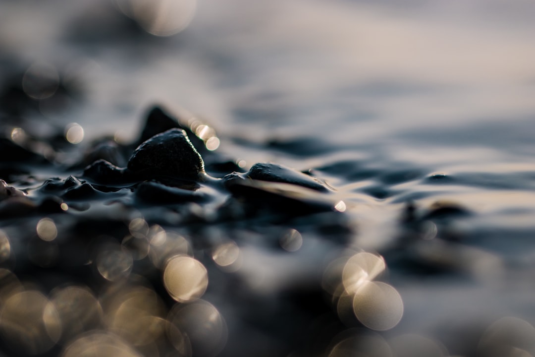 water droplets on black stone