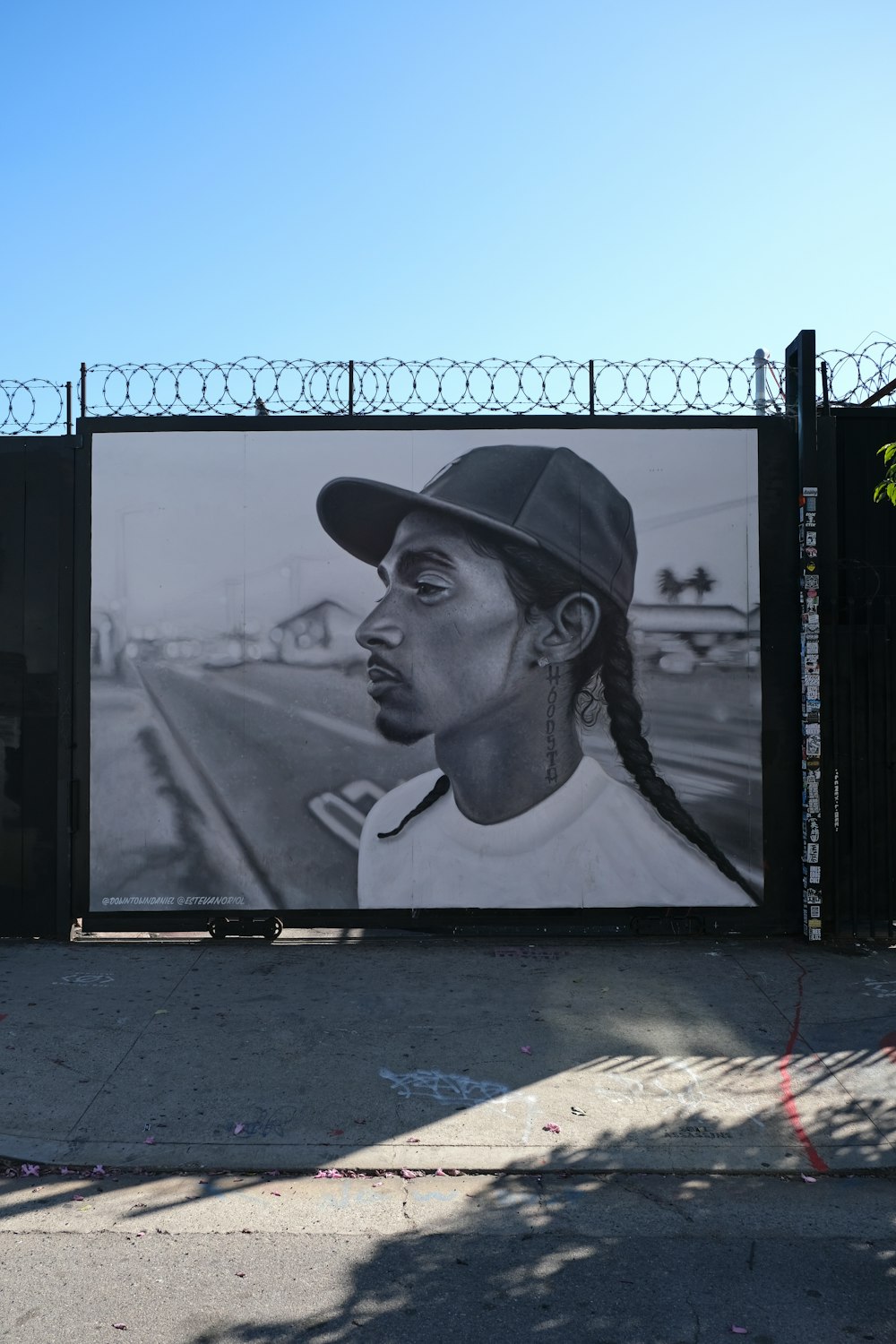 black flat screen tv turned on displaying man in black hat