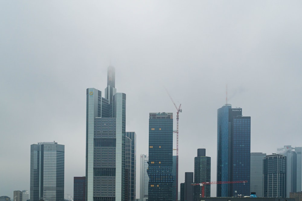 high rise buildings under white sky during daytime
