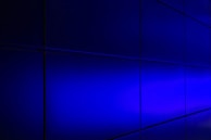 Dark-themed design system components arranged in a neat grid with subtle orange and blue gradient highlights.