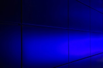 A sleek dark-themed data grid with glowing violet and silver highlights representing business intelligence.