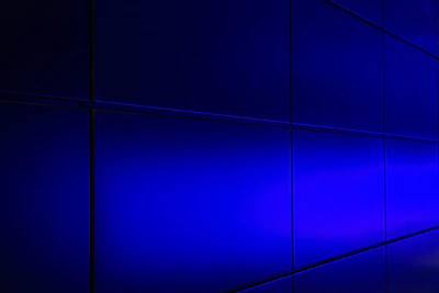 Subtle cyan and violet illuminated glass panel showing compliance data streams flowing securely.