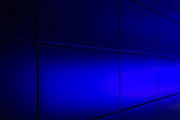 A sleek neon blue-to-green gradient dashboard panel glowing against a dark charcoal background.