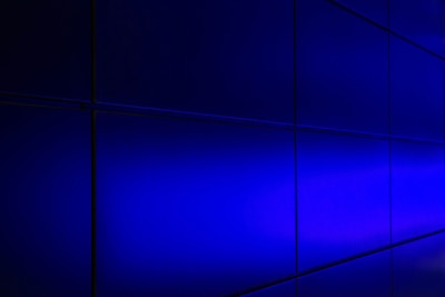 A sleek dark-themed data grid with glowing violet and silver highlights representing business intelligence.