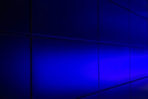 Multi-agent dashboard panel featuring glassmorphism cards and subtle blue accents.