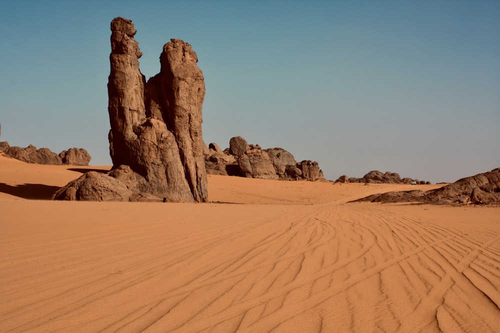 brown rock formation on desert during daytime