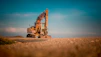 yellow and black excavator on brown sand during daytime