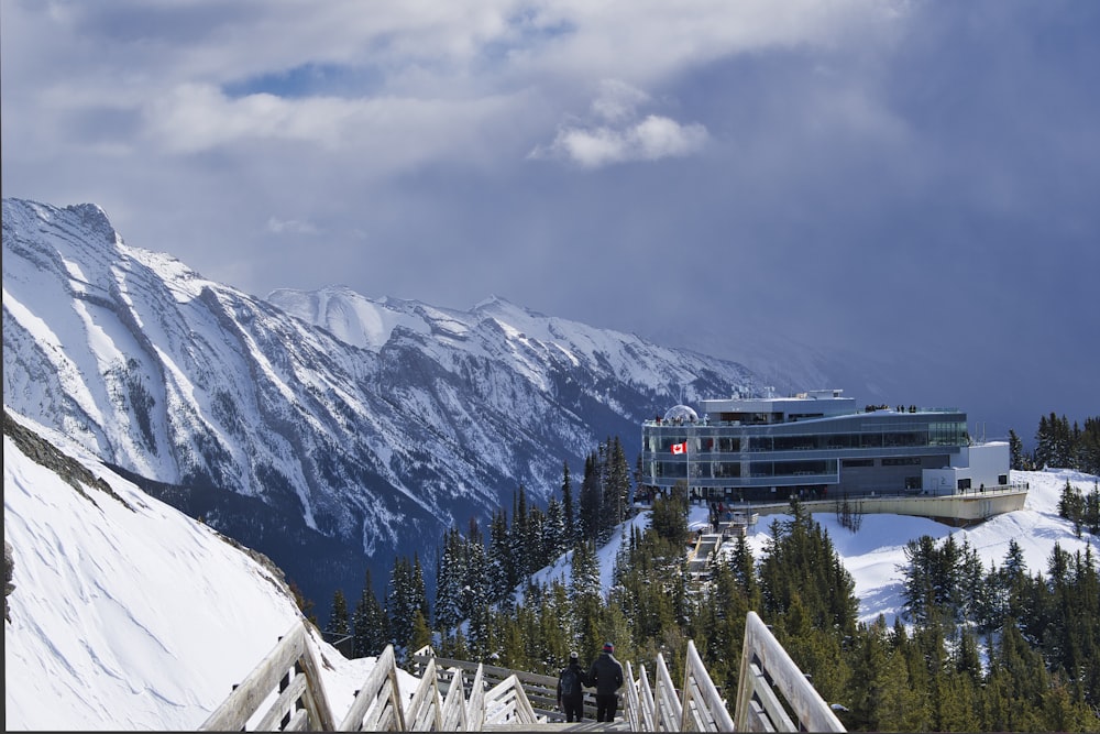 snow covered mountain under cloudy sky during daytime