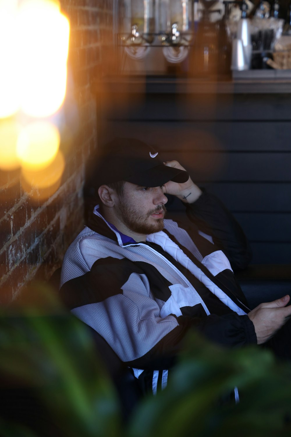 man in blue and white striped polo shirt wearing black sunglasses