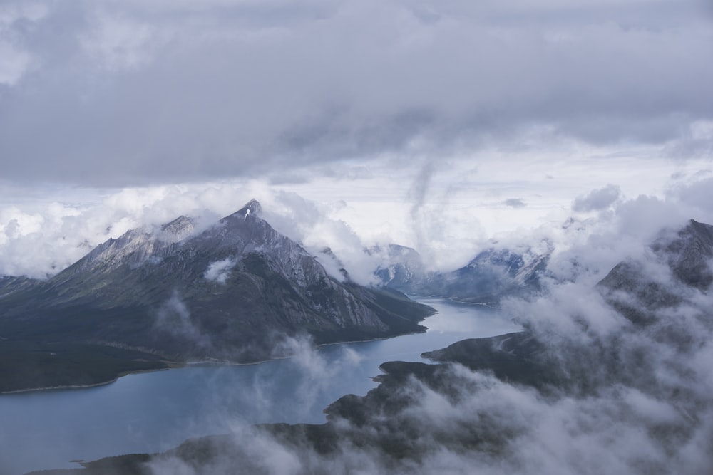 snow covered mountain under cloudy sky during daytime