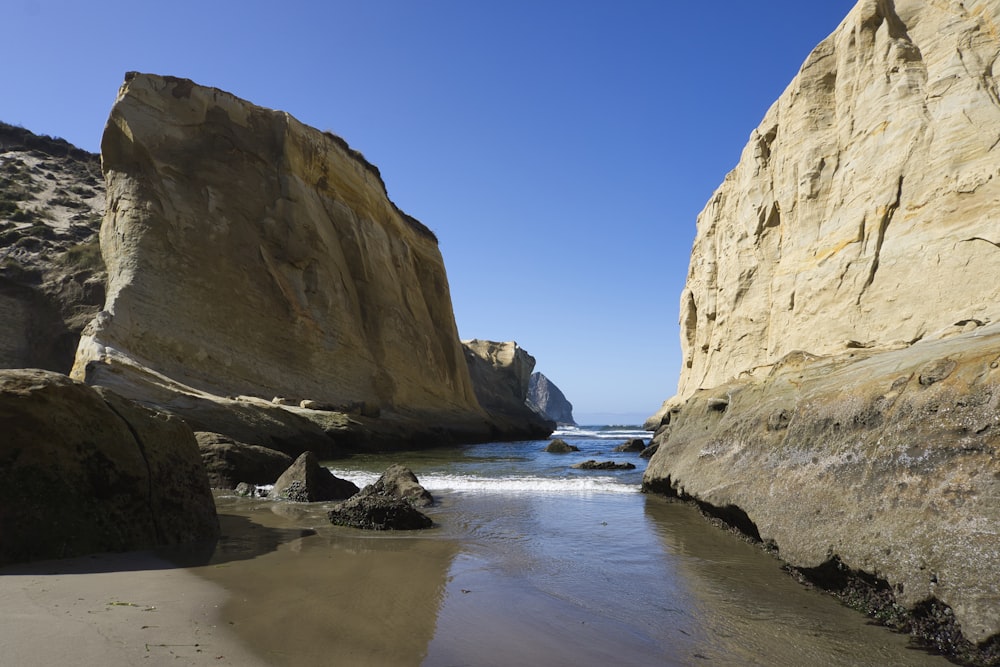 brown rock formation on sea shore during daytime