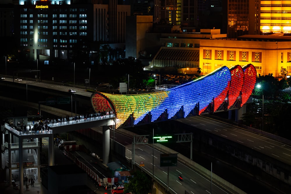 blue red and white flag on top of building during night time