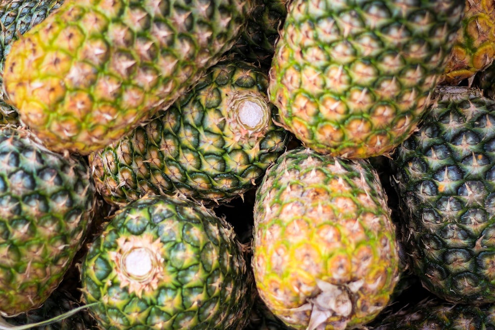 green and yellow pineapple fruits