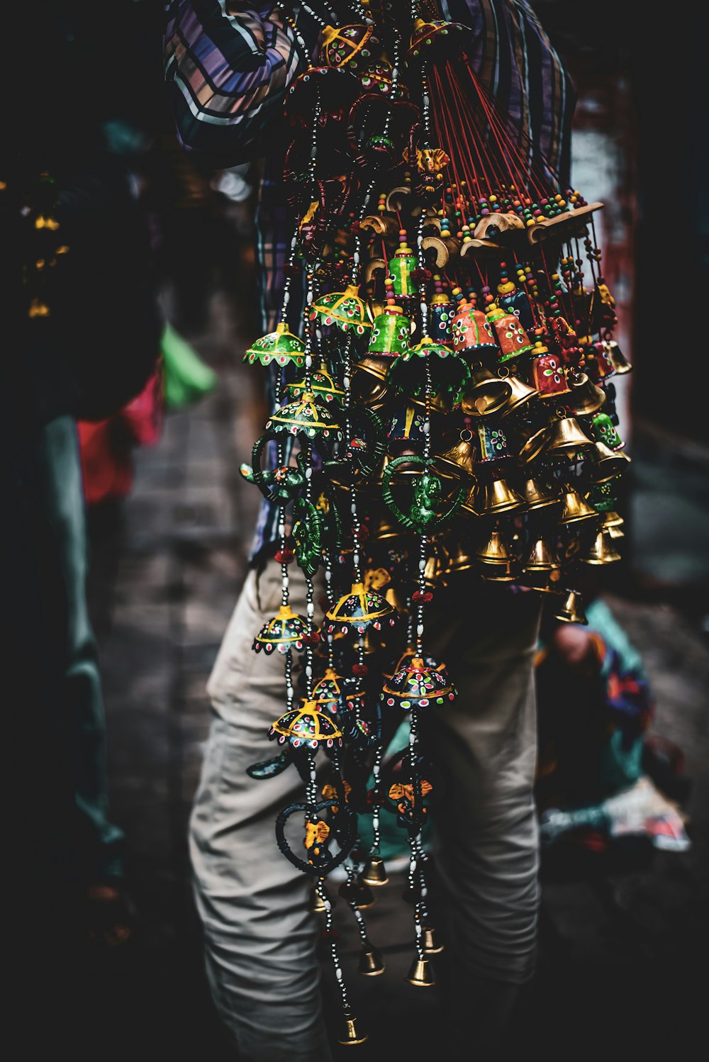 gold and silver bell hanging on christmas tree