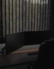 An empty, quiet office space with a turned-off computer and a note saying 'Closed'.