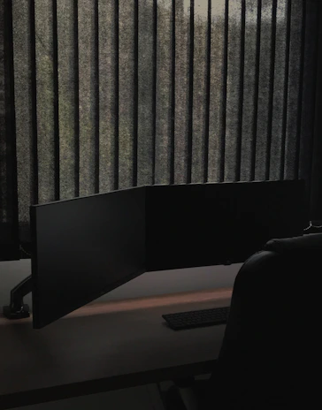 An empty, quiet office space with a turned-off computer and a note saying 'Closed'.