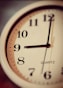white and brown analog clock